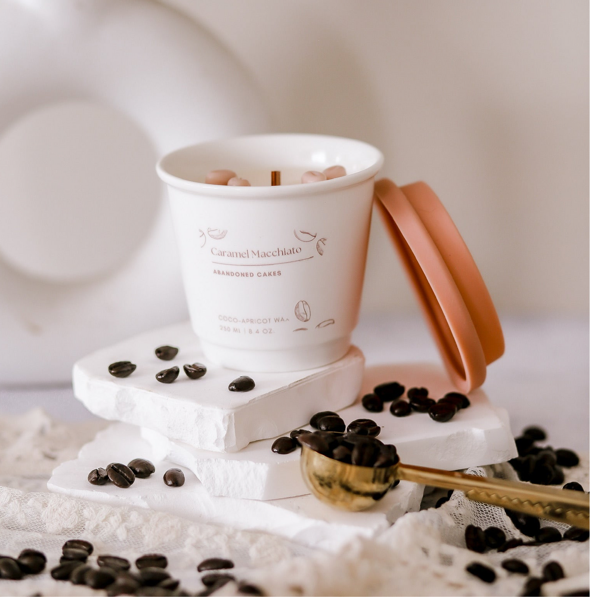 •	“Caramel Macchiato Candle by Abandoned Cakes in ceramic to-go cup with cozy coffeehouse tones”
	•	“Coffee and caramel-scented candle with wooden wick in a ceramic to-go vessel”